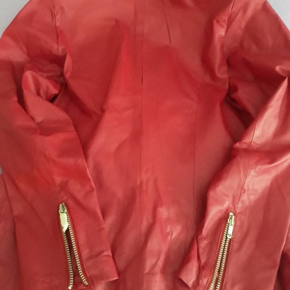 Leather, red zippered jacket and matching skirt
